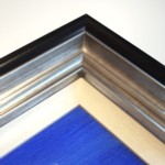 Wide frame in black and silver with painted white slip