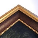 Gold frame with wood slip and then a fine beaded gold slip