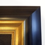 Wide frame in tones of grey and black then gold with gold beaded slip